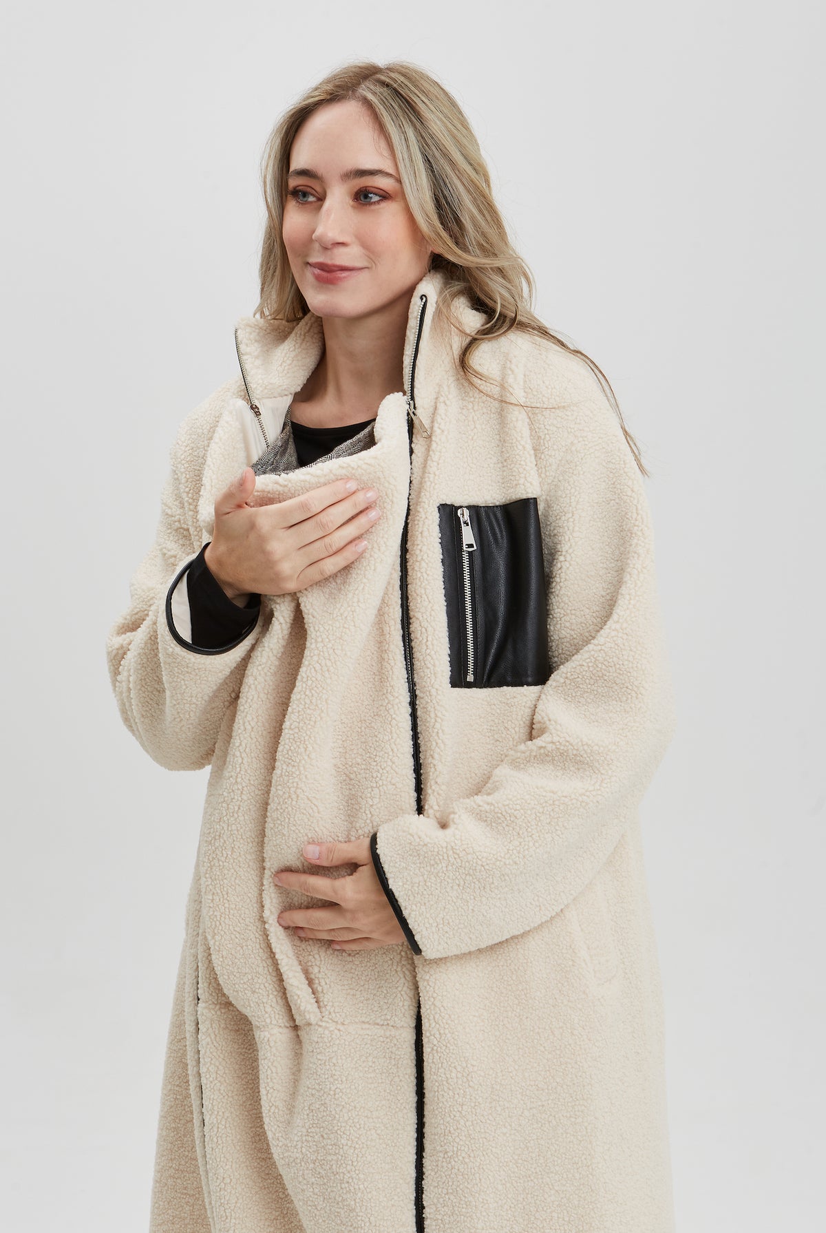 NOM Maternity Teddi Coat in Cream, close-up view of zipper panel open