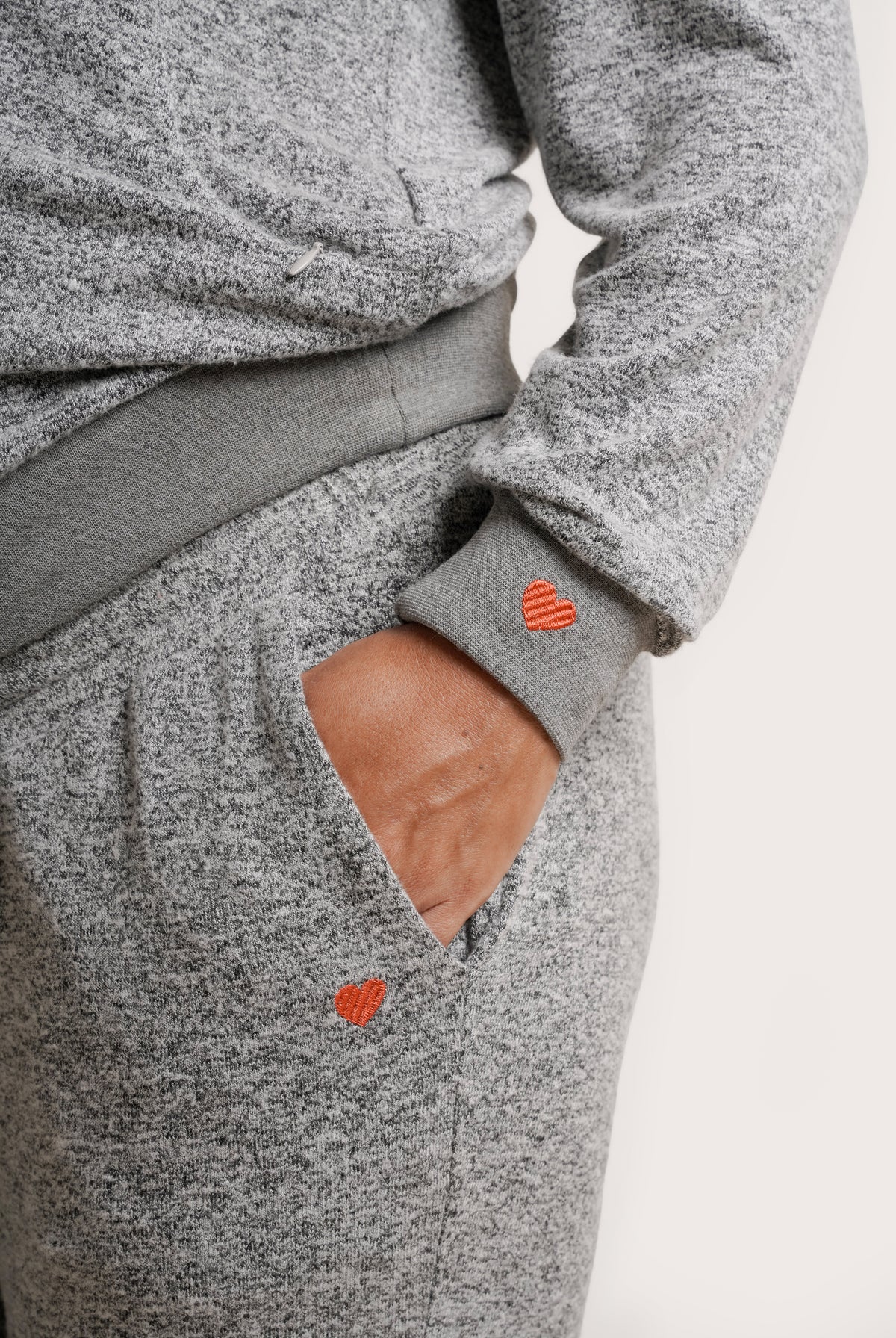 NOM Maternity Heart On My Pocket Sweatpants in Grey, close-up view of pocket with heart-shaped embroidery