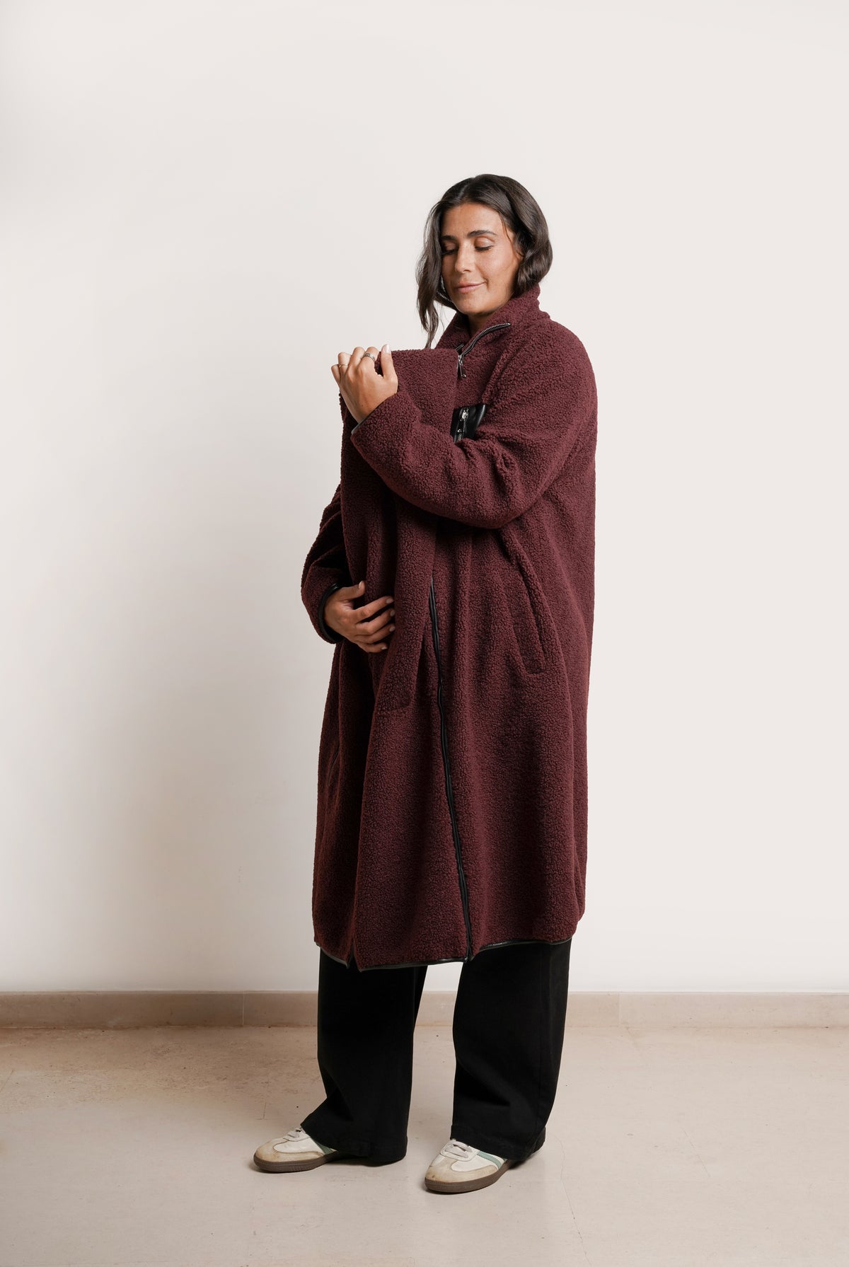 NOM Maternity Teddi Coat in Burgundy, side view showing zipper panel open