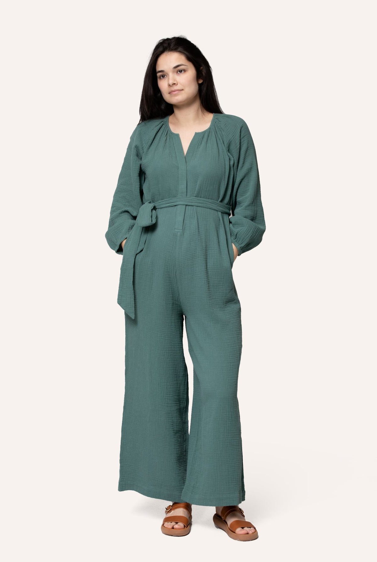 NOM Maternity Alma Nursing Jumpsuit in Eucalyptus, full front view showing nursing access, waist wrap, pockets and wide-leg fit.