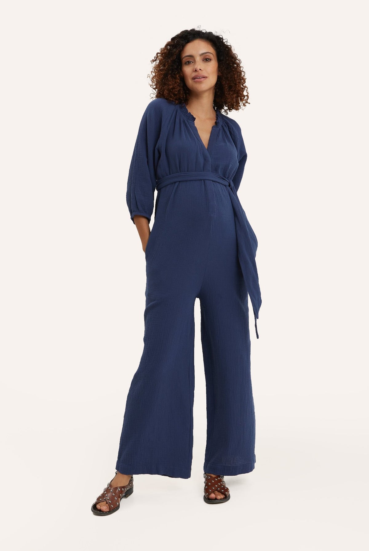 NOM Maternity Alma Nursing Jumpsuit in Navy, full front view showing nursing access, waist wrap, pockets and wide-leg fit.