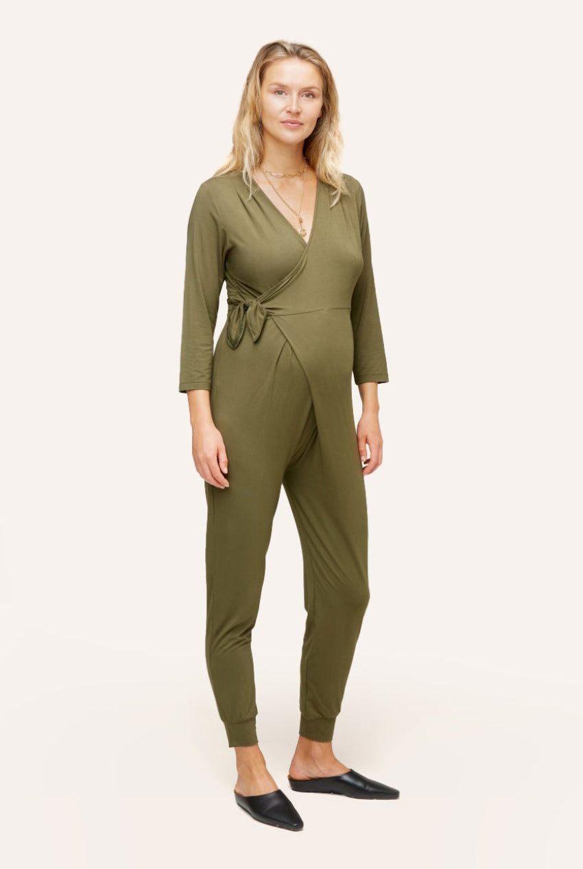 NOM Maternity Amabella Jumpsuit in Olive, three-quarter view of wrap detail with bump