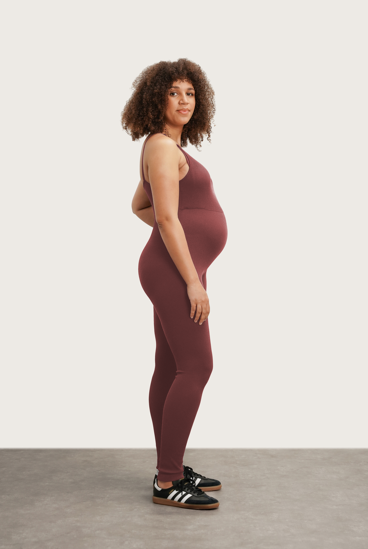 NOM Maternity The Jordan Nursing Jumpsuit in Burgundy, side view with bump
