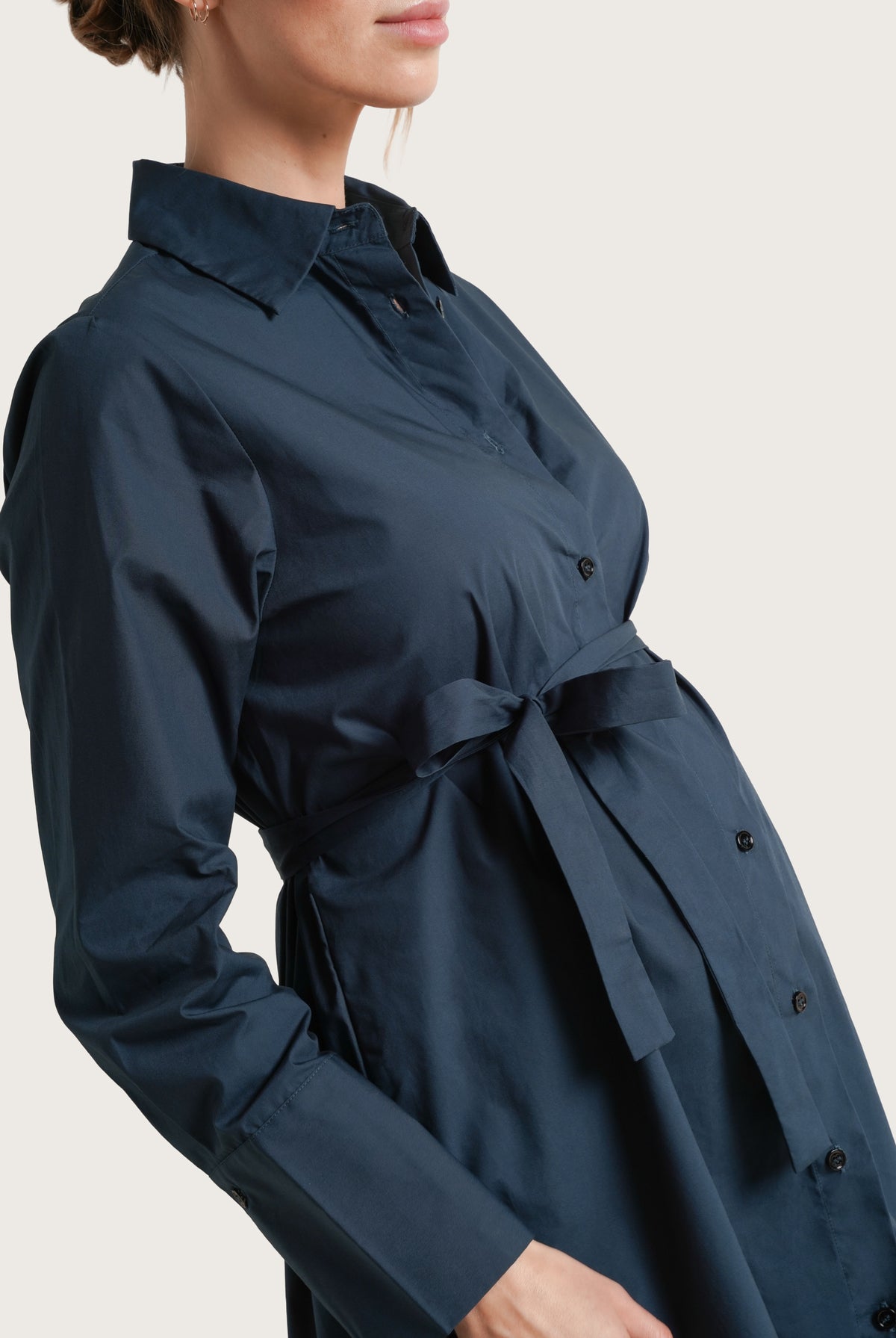 NOM Maternity The Weekday Dress in Dark Teal, close-up side view showing front tie, sleeve cuff and fabric