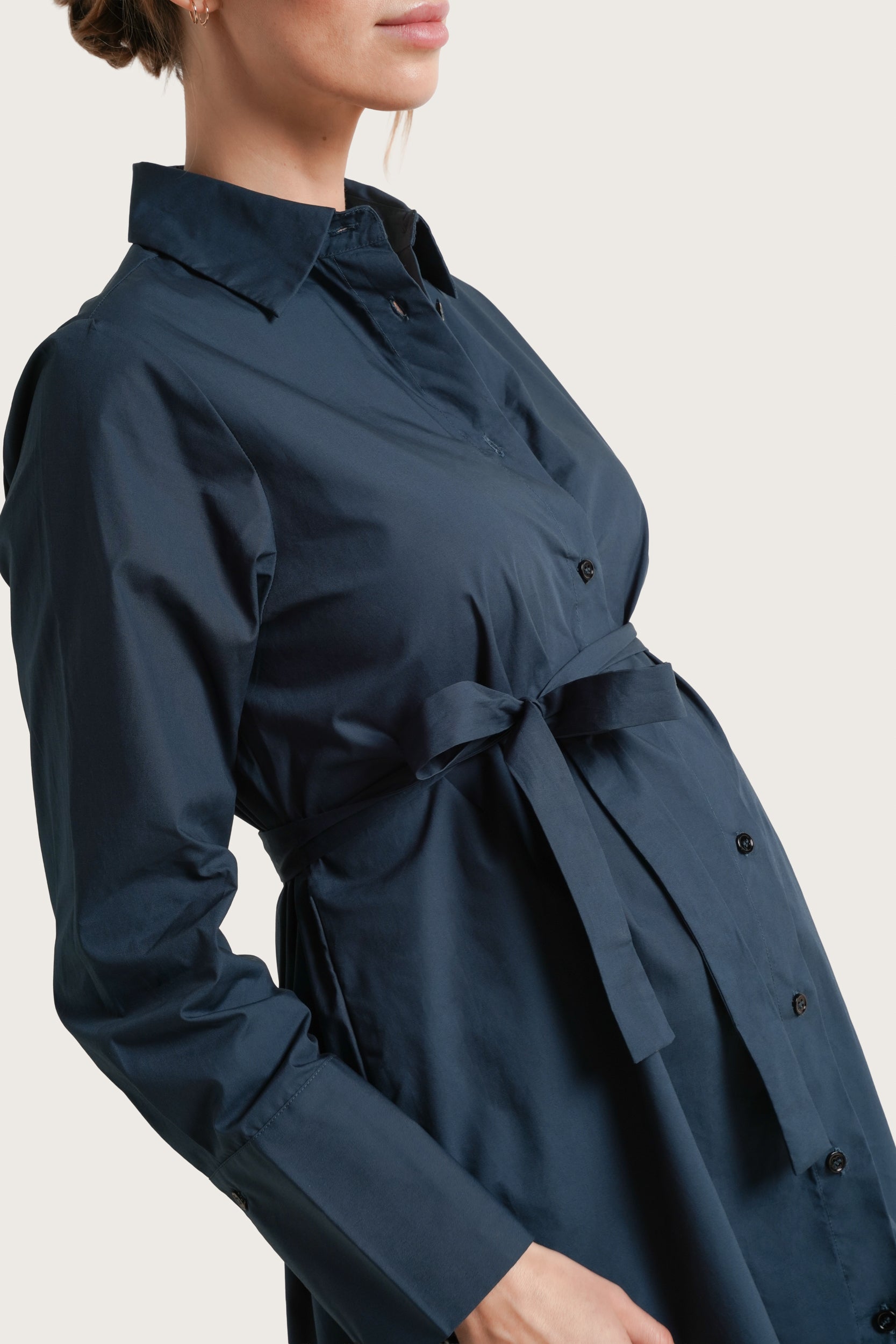 NOM Maternity The Weekday Dress in Dark Teal, close-up side view showing front tie, sleeve cuff and fabric