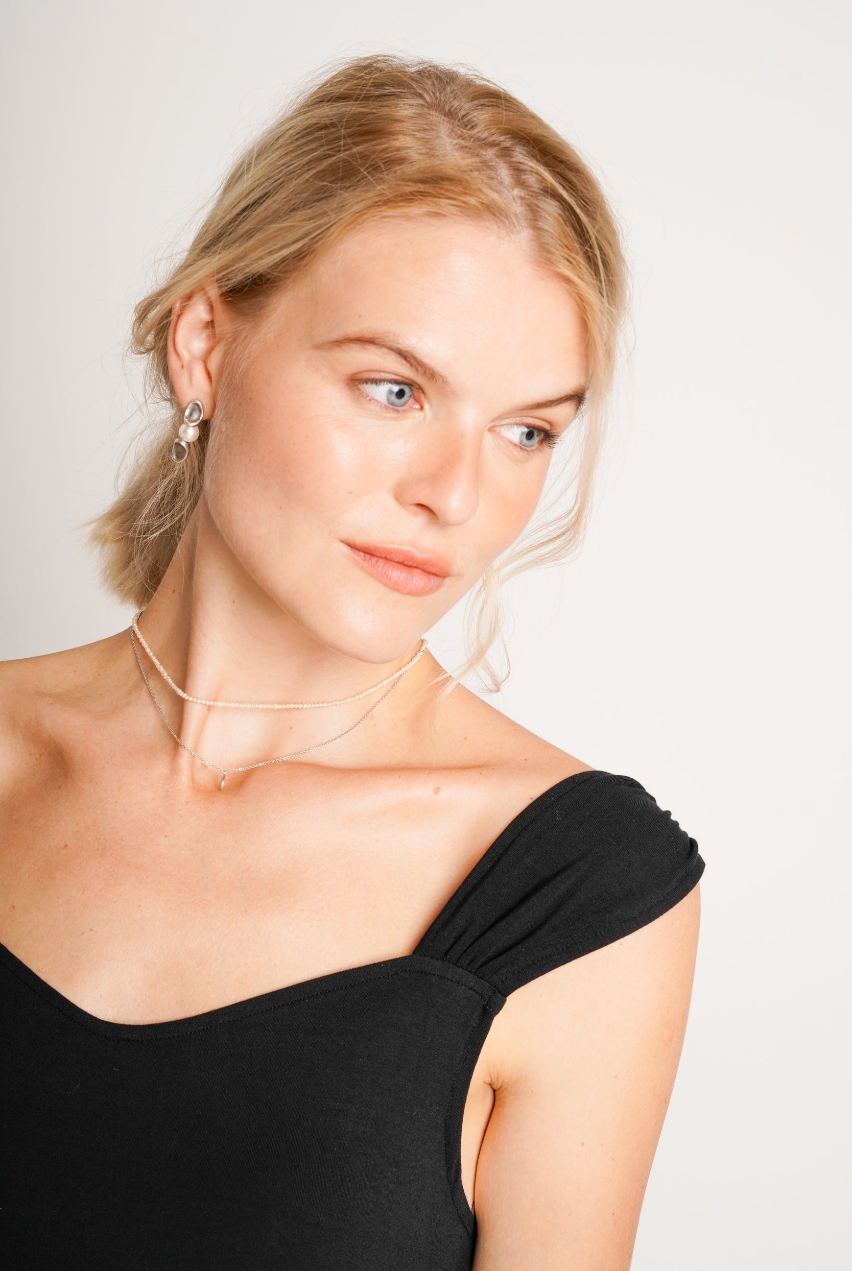 NOM Maternity Zoey Dress in Black, close-up strap detail view