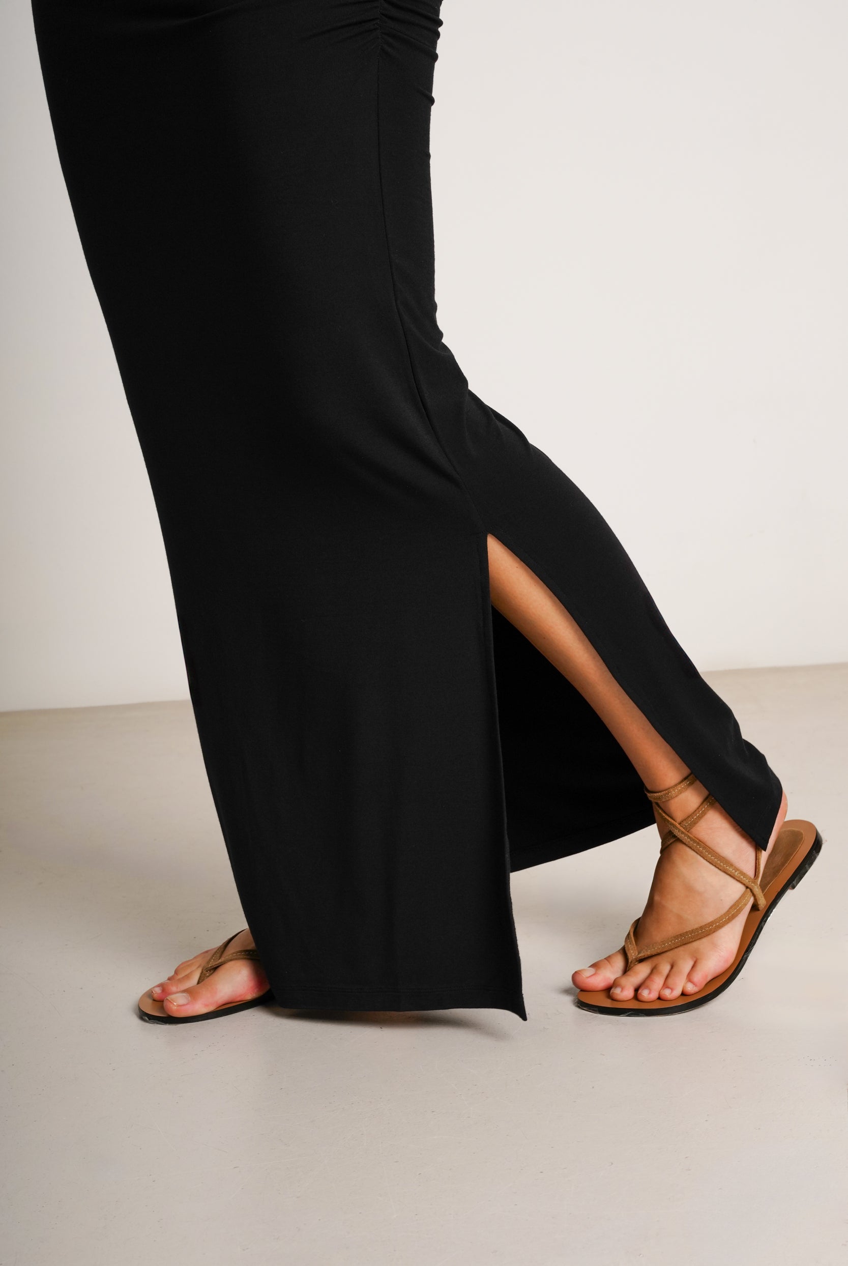 NOM Maternity Zoey Dress in Black, close-up side slit view
