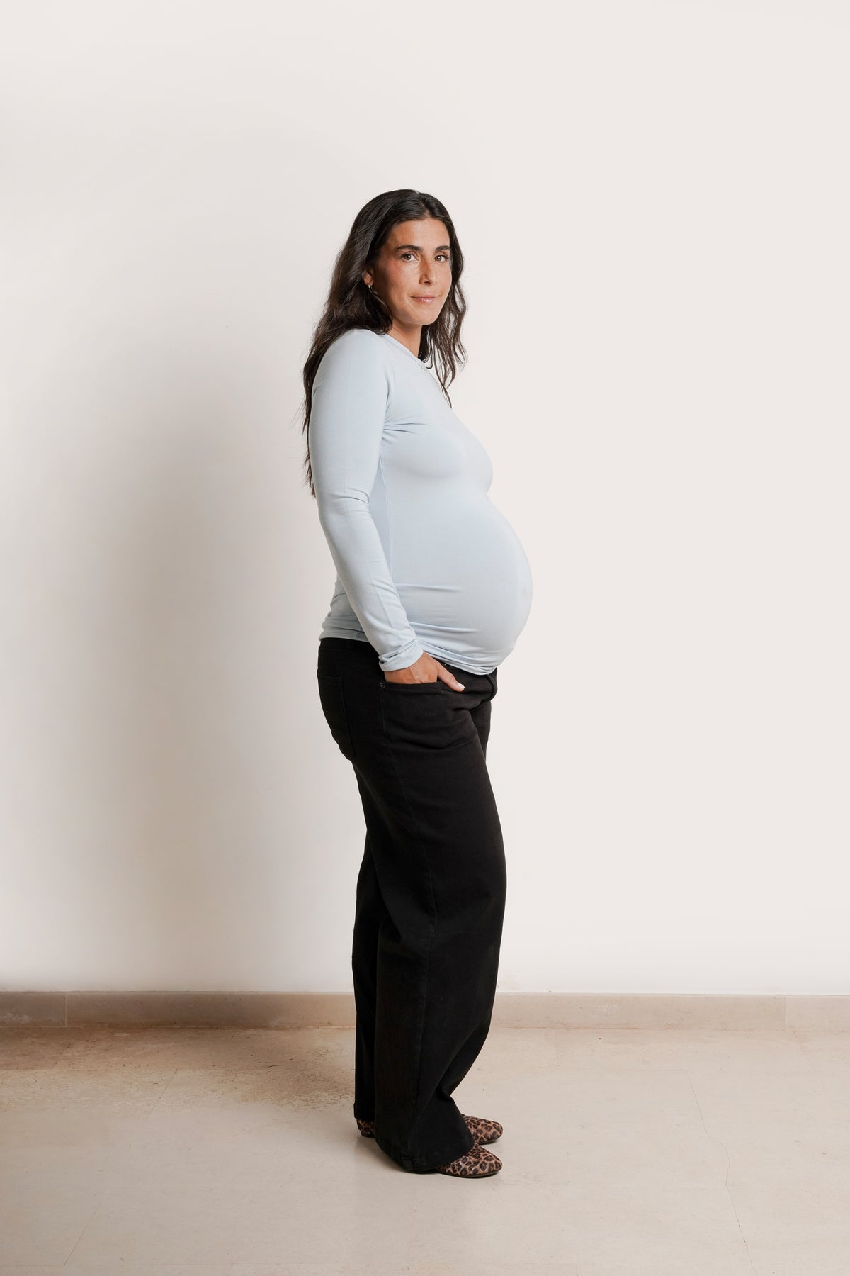 NOM Maternity Liv Long Sleeve Crew Neck Tee in Ice Blue, side view with bump