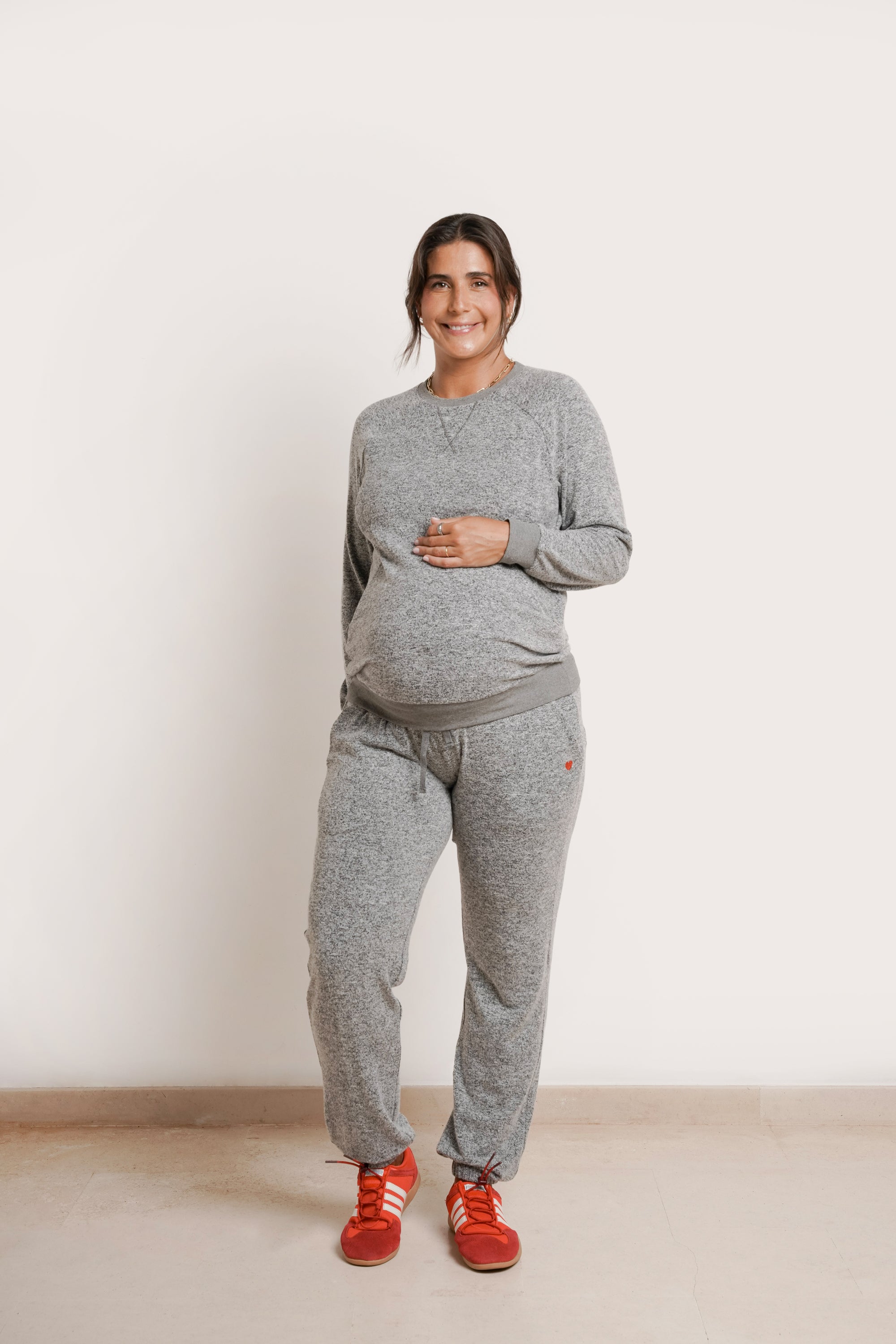 NOM Maternity Heart On My Sleeve Sweatshirt in Grey, full front view with bump