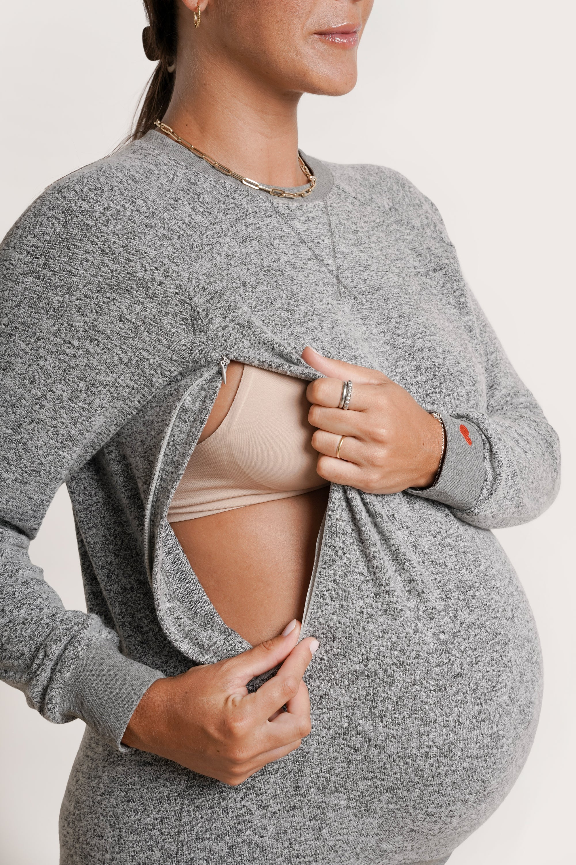 NOM Maternity Heart On My Sleeve Sweatshirt in Grey, close-up view of side zipper for nursing access 