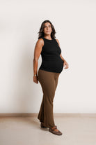 NOM Maternity Georgina Knit Pant in Chocolate, side view with bump, flare fit