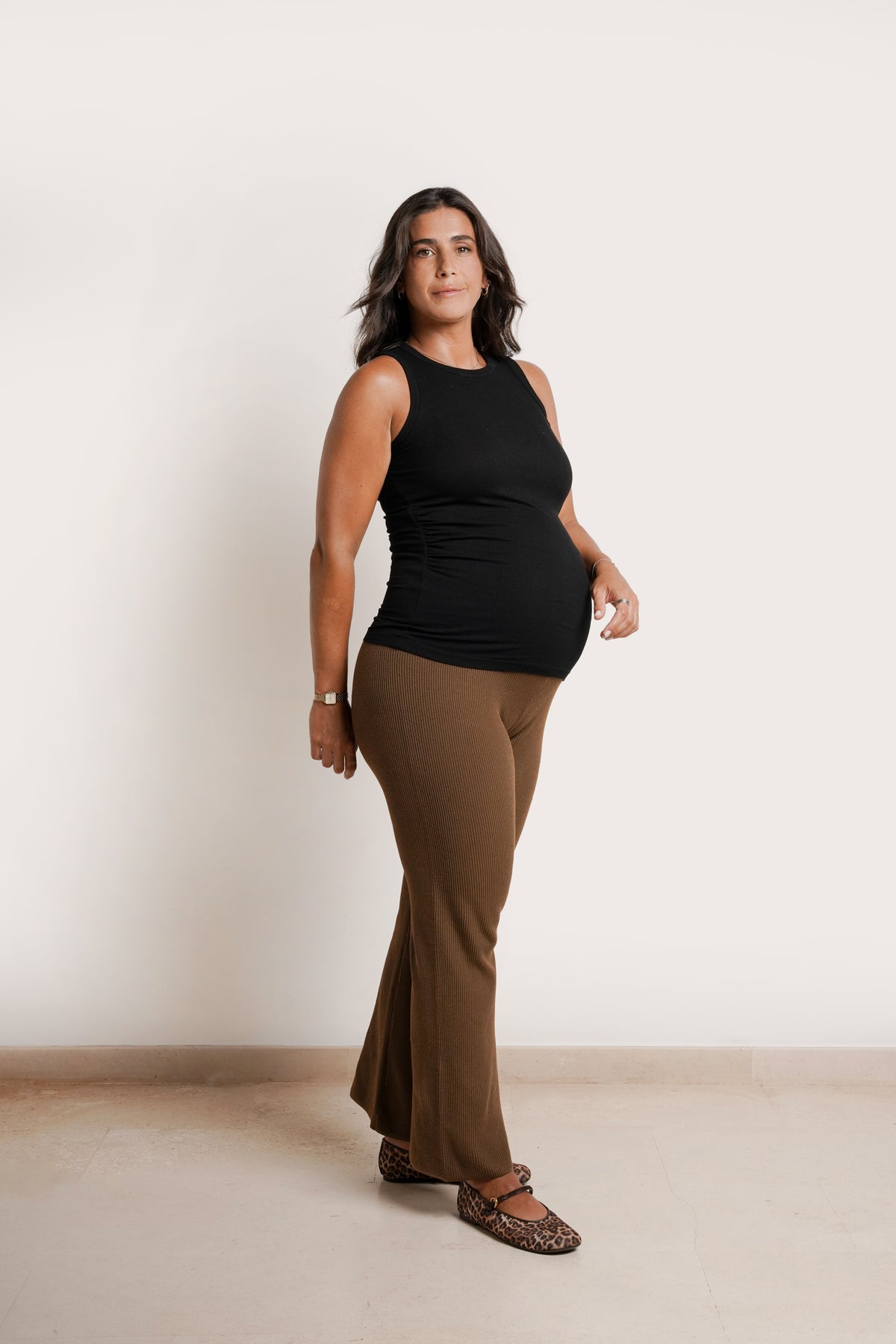 NOM Maternity Georgina Knit Pant in Chocolate, side view with bump, flare fit