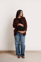 NOM Maternity Thomasine Sweater Cardigan in Chocolate, front view open wiht bump